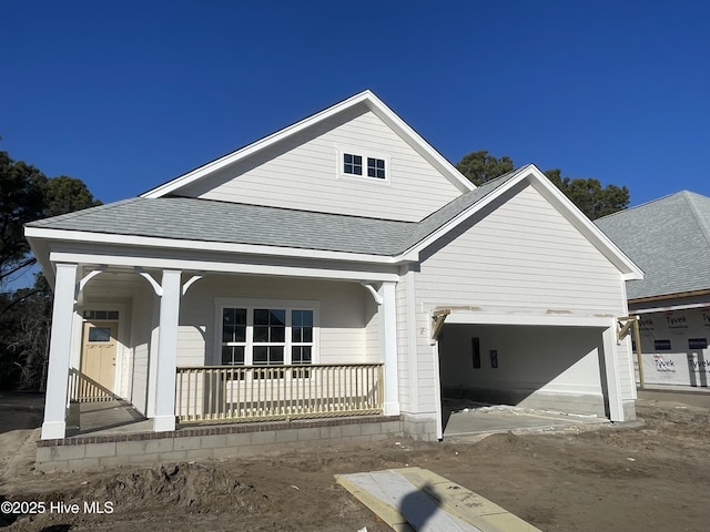 view of front of home featuring a garage and covered porch