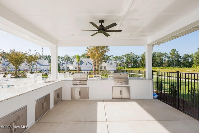 view of patio / terrace with sink, area for grilling, ceiling fan, and a grill