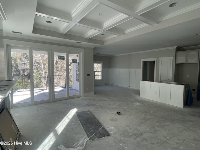 unfurnished living room with ornamental molding, coffered ceiling, a wealth of natural light, and beamed ceiling