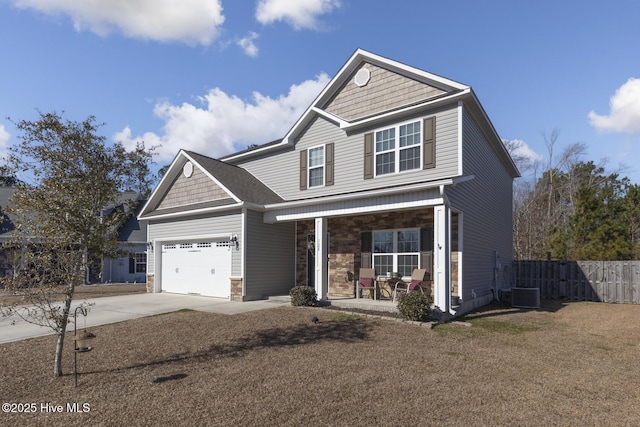 craftsman-style home featuring a garage, a porch, and a front lawn