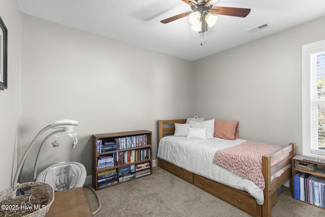 carpeted bedroom featuring ceiling fan