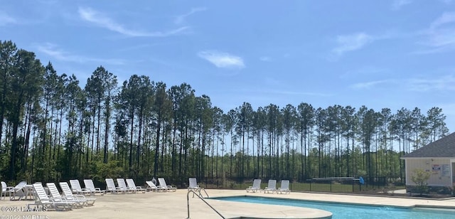 view of swimming pool featuring a patio