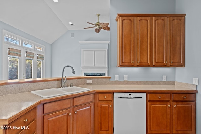 kitchen featuring lofted ceiling, ceiling fan, sink, and white dishwasher