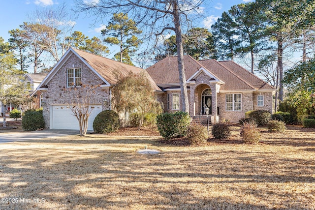 view of front of home featuring a garage and a front lawn