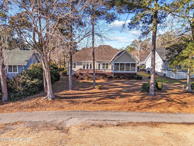 view of front facade with a sunroom