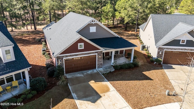 view of front facade featuring central AC and a porch