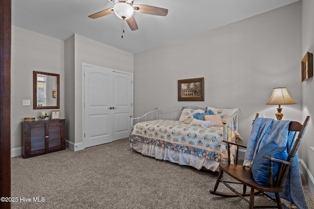 bedroom featuring ceiling fan and carpet