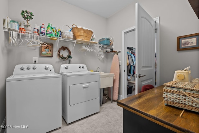 laundry area with separate washer and dryer