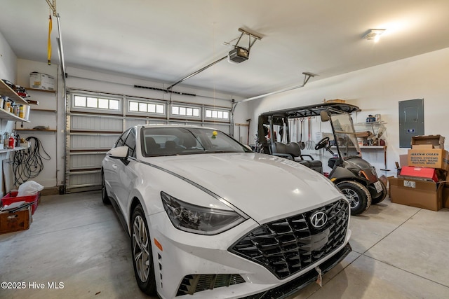 garage featuring a garage door opener and electric panel