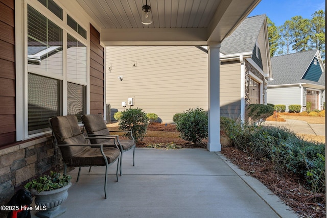 view of patio / terrace with a garage