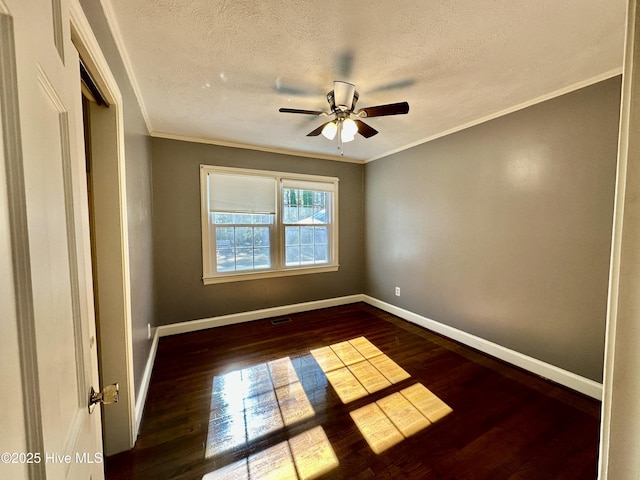 unfurnished room with dark wood-type flooring, ceiling fan, crown molding, and a textured ceiling