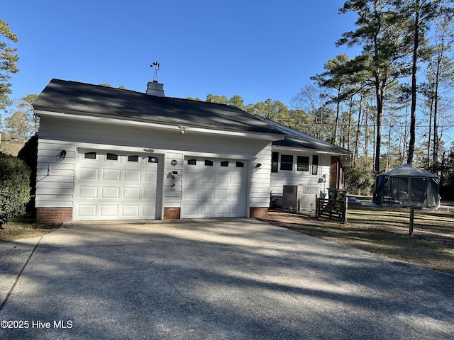 view of side of property featuring a garage