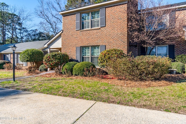 view of home's exterior featuring a lawn