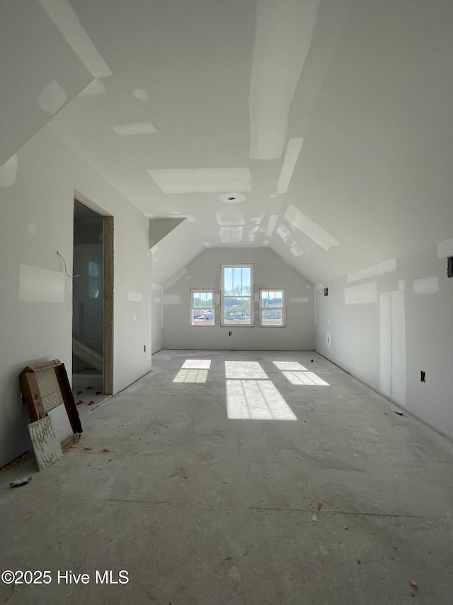 bonus room featuring vaulted ceiling