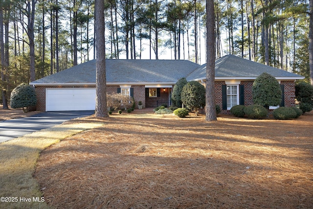 ranch-style home featuring a garage