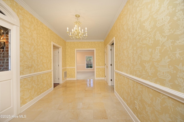 hall with a chandelier and crown molding