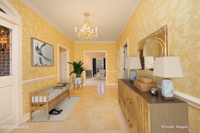 hallway with crown molding and a chandelier