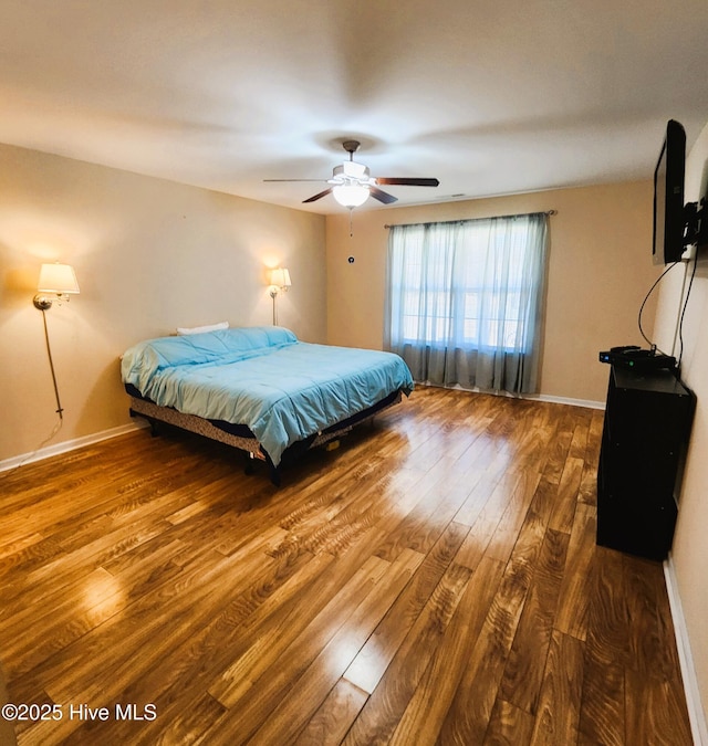 bedroom featuring ceiling fan and hardwood / wood-style floors