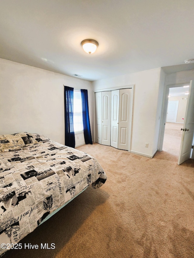 carpeted bedroom with a closet