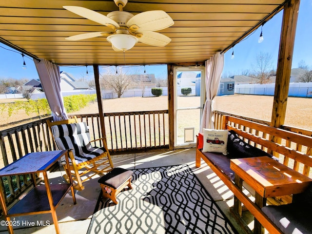 sunroom with ceiling fan and a wealth of natural light