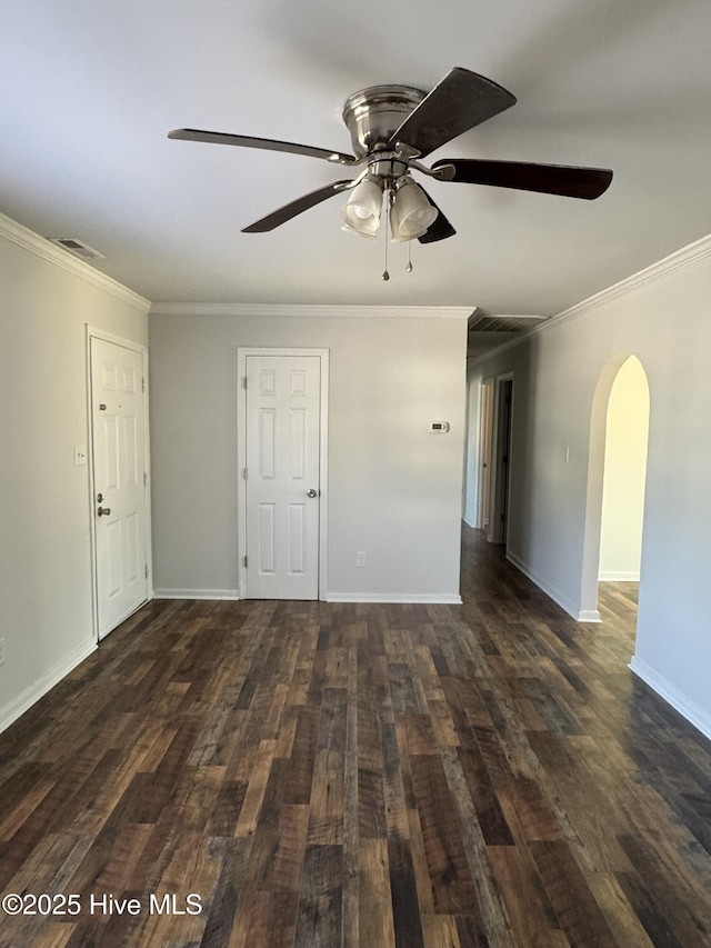 unfurnished room featuring crown molding, ceiling fan, and dark hardwood / wood-style flooring