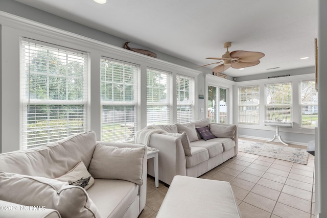 sunroom with plenty of natural light and ceiling fan