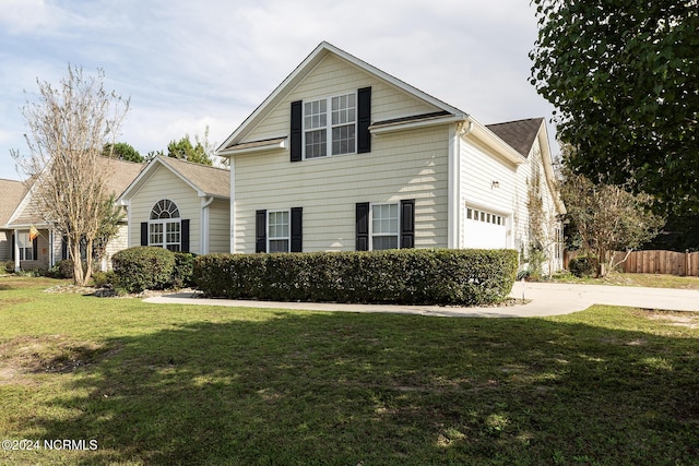 front facade featuring a garage and a front lawn