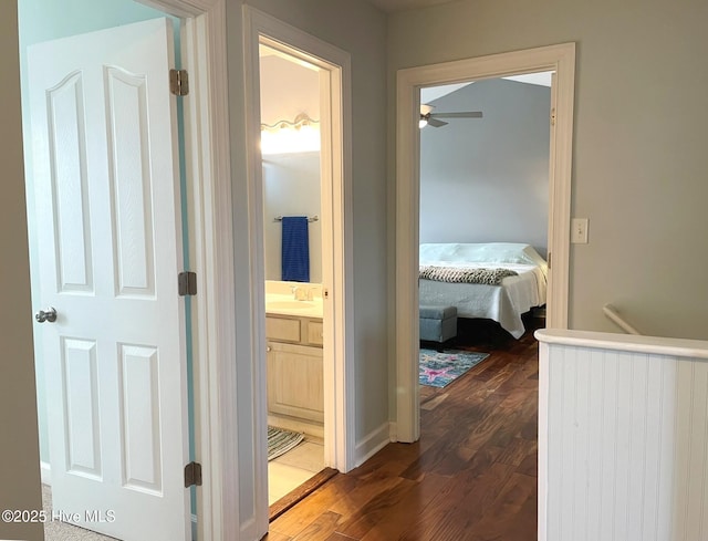 hall with sink and dark hardwood / wood-style flooring