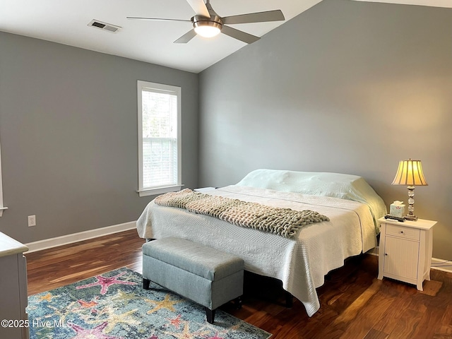 bedroom with ceiling fan, lofted ceiling, and dark hardwood / wood-style floors