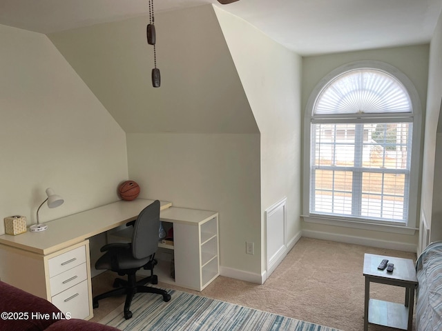 carpeted office space featuring lofted ceiling and a healthy amount of sunlight