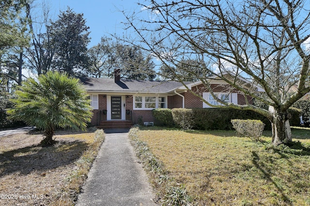 ranch-style home with a front lawn