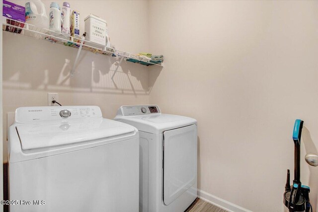 washroom with separate washer and dryer