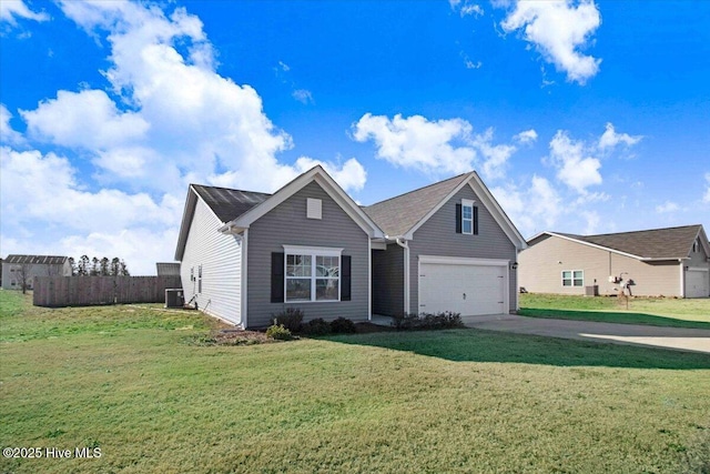 view of front facade with a garage, central AC unit, and a front yard