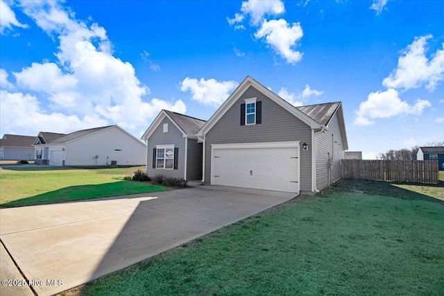 view of front of property featuring a front lawn and a garage