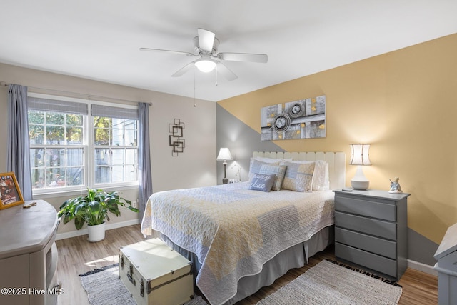 bedroom with light wood-type flooring and ceiling fan