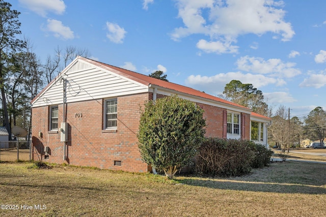 view of home's exterior featuring a yard