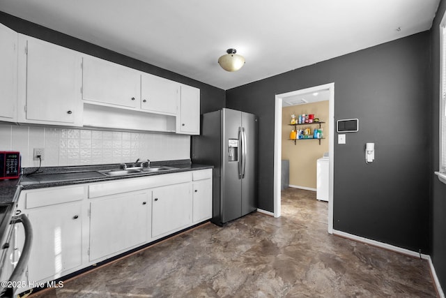 kitchen with sink, white cabinetry, stainless steel appliances, and tasteful backsplash