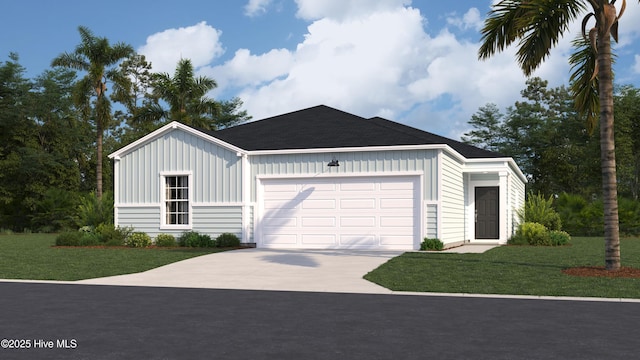 view of front of home featuring a front yard and a garage