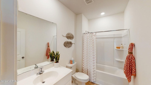 full bathroom featuring toilet, shower / bath combination with curtain, and vanity