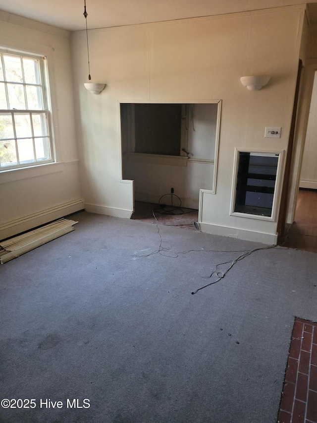 unfurnished living room featuring carpet