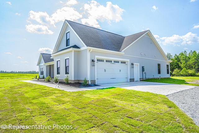 view of front facade with a front lawn and a garage