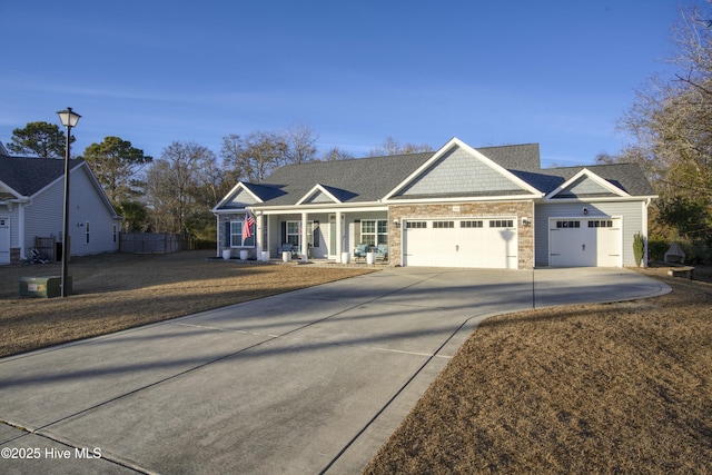 view of front of home with a garage and covered porch