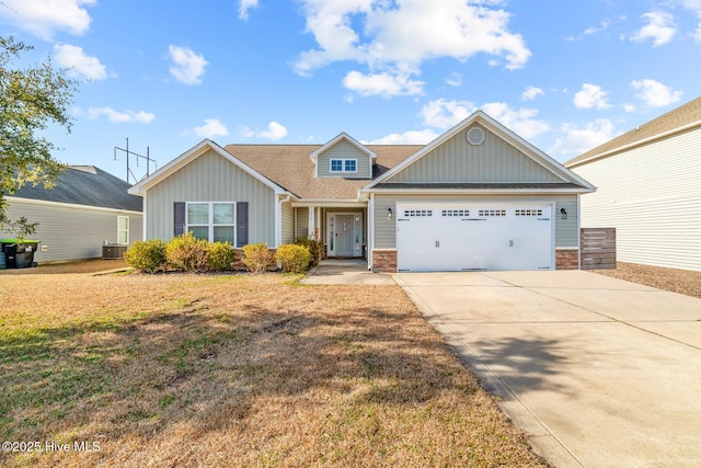 craftsman house with a garage, central AC, and a front lawn