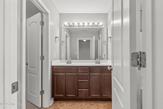 bathroom featuring vanity and tile patterned flooring