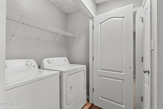 clothes washing area featuring washing machine and dryer