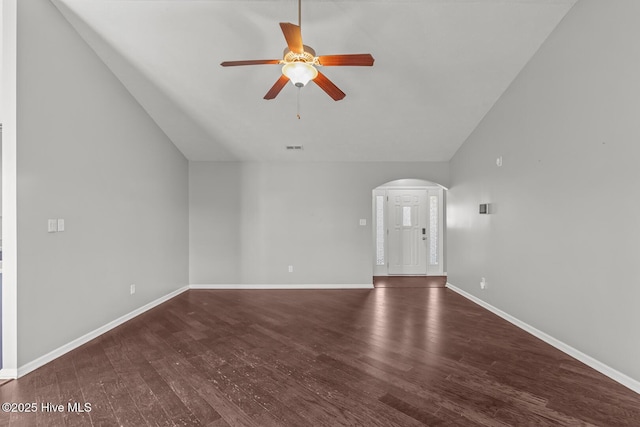 unfurnished living room featuring vaulted ceiling, ceiling fan, and dark hardwood / wood-style flooring