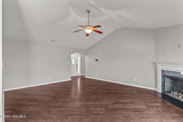 unfurnished living room with ceiling fan, dark hardwood / wood-style flooring, and vaulted ceiling