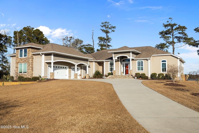 view of front facade with a garage and a front yard