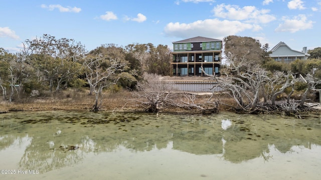 back of house featuring a water view