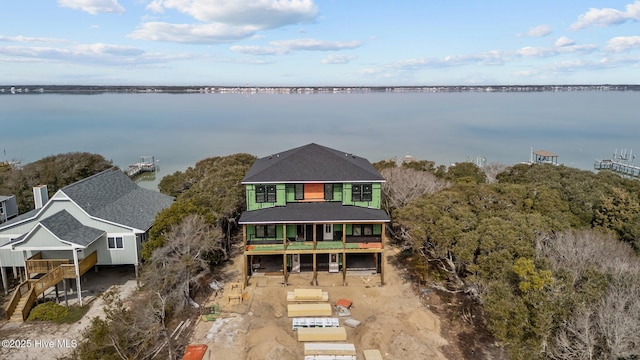 drone / aerial view with a water view